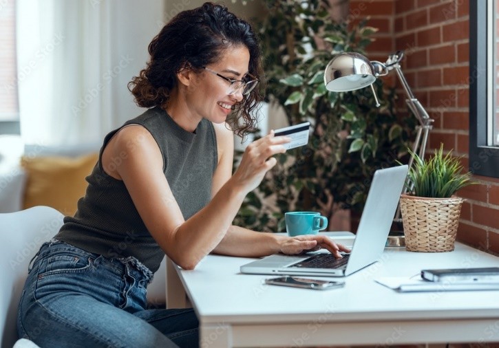 Woman interacting with webinar on laptop