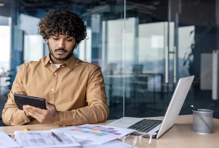 Image of man looking at financial accounts