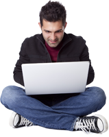 Guy sitting cross-legged with his laptop in his lap