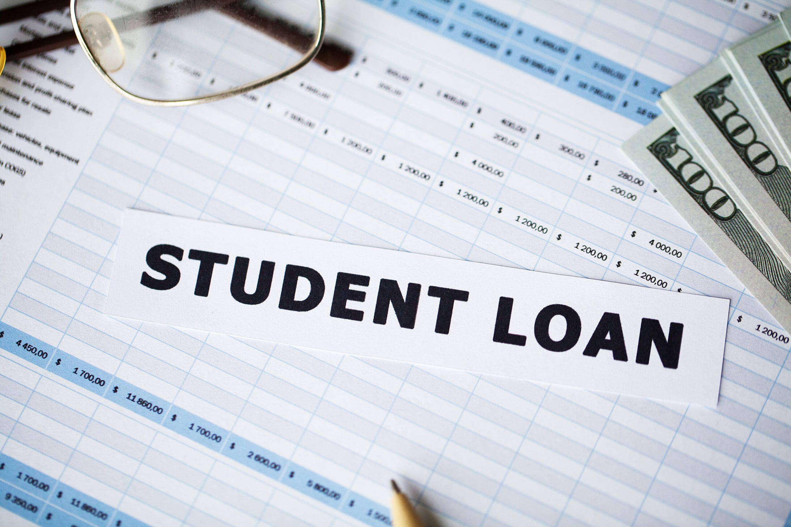 Student loan written on white card